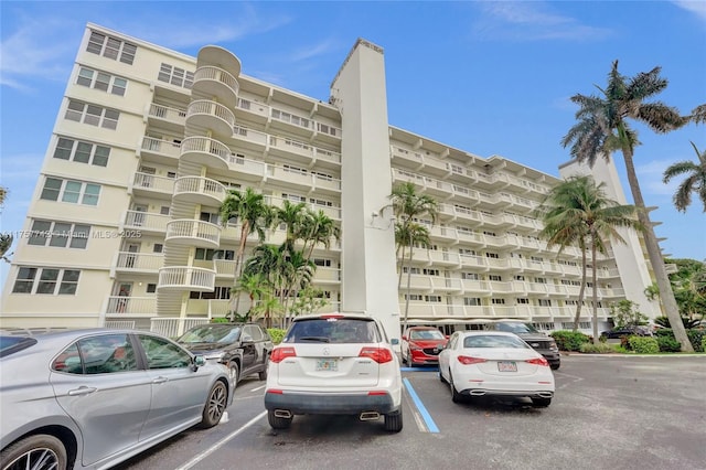 view of property featuring uncovered parking