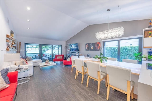 interior space with visible vents, an inviting chandelier, wood finished floors, and vaulted ceiling