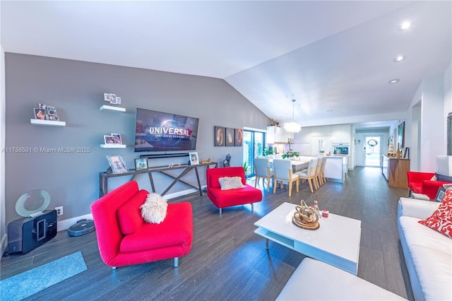 living room featuring a wealth of natural light, baseboards, lofted ceiling, and wood finished floors