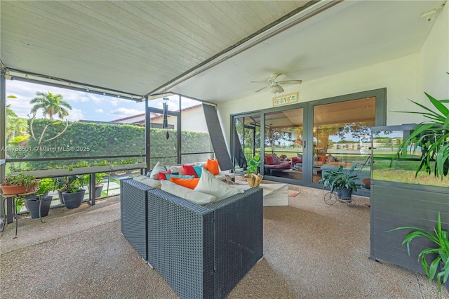 sunroom with a ceiling fan