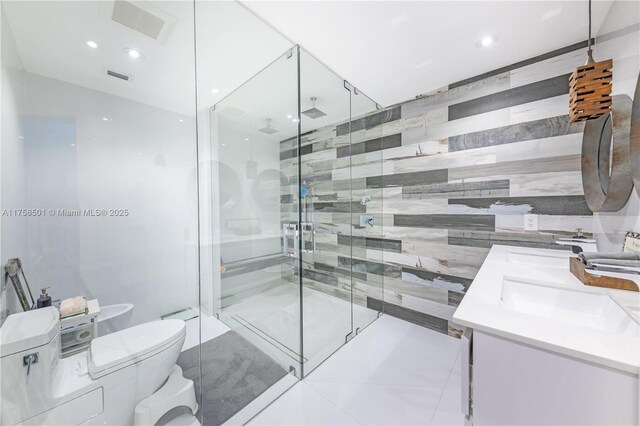 bathroom featuring double vanity, a sink, a shower stall, tile walls, and toilet