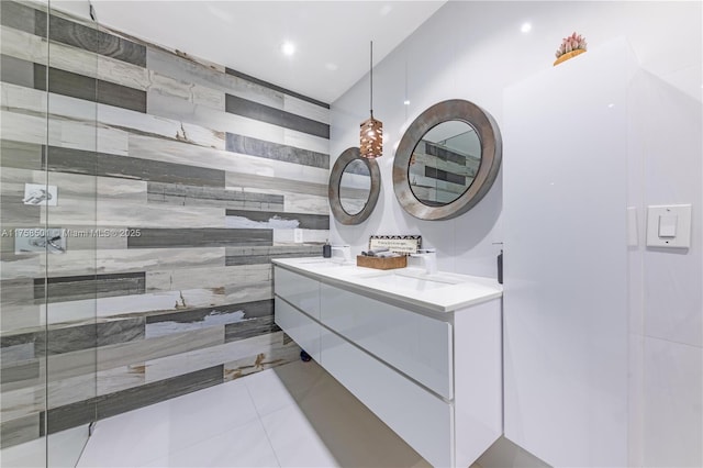 bathroom featuring tile patterned floors, tile walls, and tiled shower