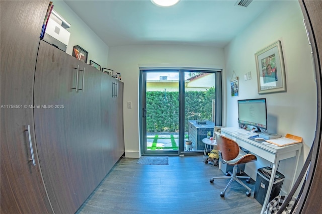 office space featuring baseboards and wood finished floors