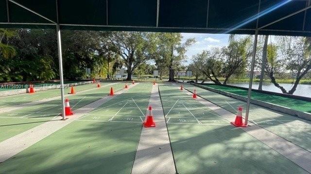 view of home's community with shuffleboard