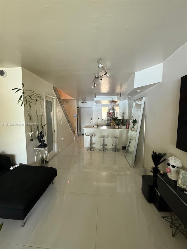 interior space with a sink and light tile patterned floors