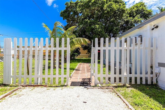 view of gate with fence