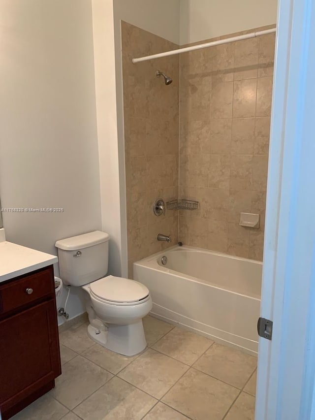 full bath featuring toilet, shower / bath combination, vanity, and tile patterned floors