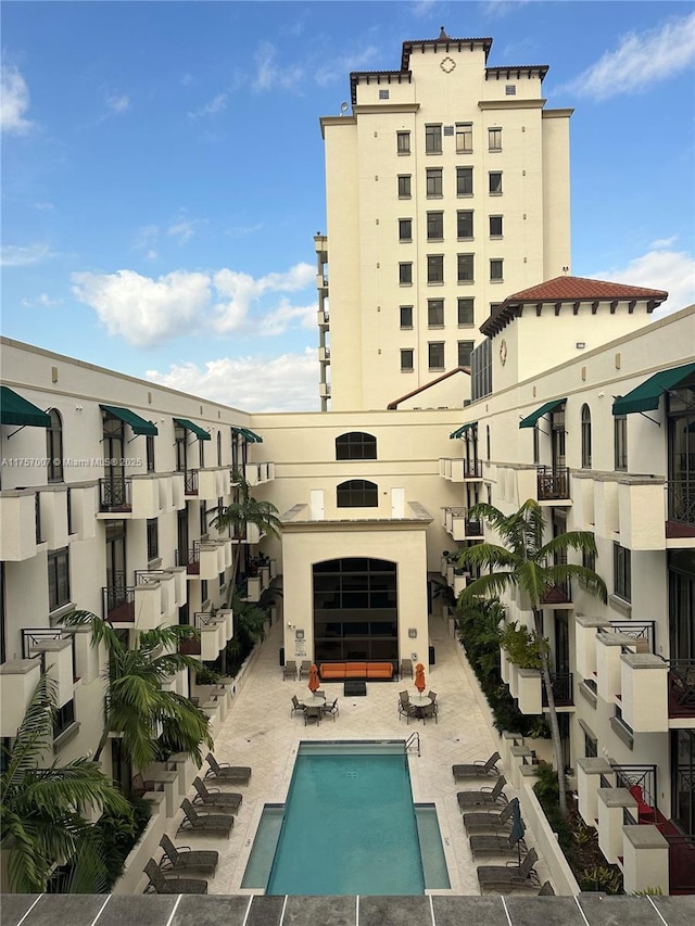 view of property featuring a community pool