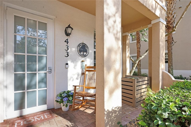 doorway to property with stucco siding