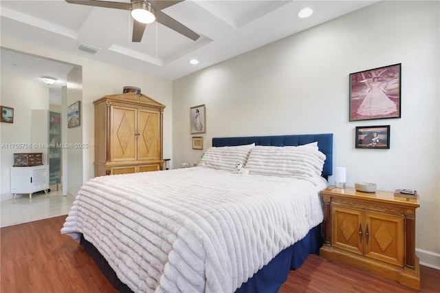 bedroom with recessed lighting, visible vents, ceiling fan, and wood finished floors