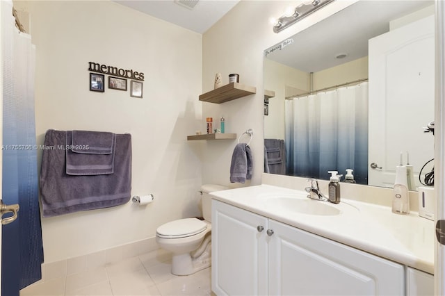 bathroom featuring baseboards, a shower with curtain, toilet, vanity, and tile patterned flooring