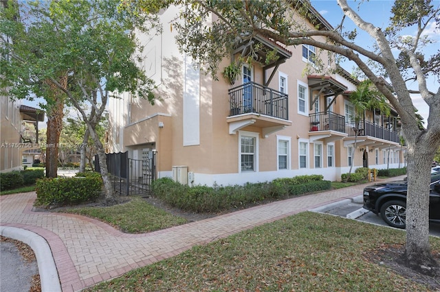 view of side of property featuring stucco siding