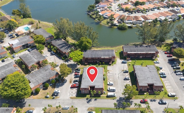 birds eye view of property with a residential view and a water view