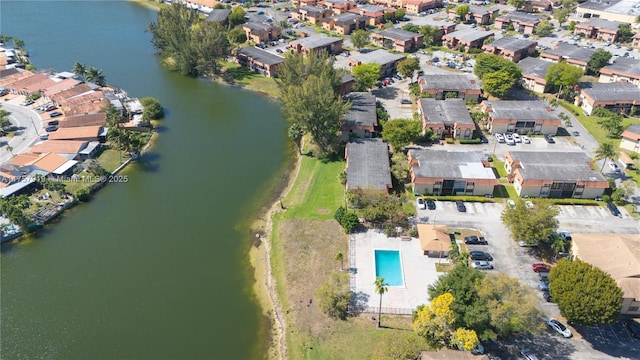 bird's eye view featuring a water view and a residential view