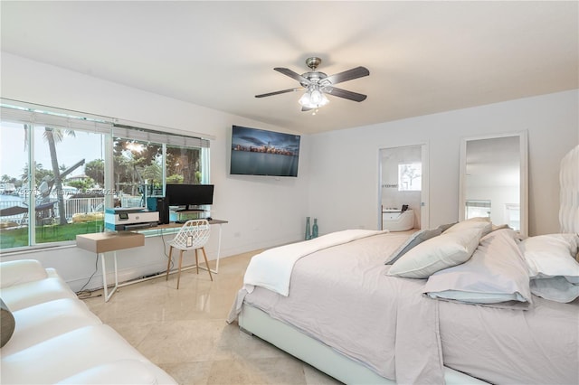 bedroom with light tile patterned floors, a ceiling fan, and baseboards