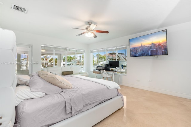 bedroom with a ceiling fan, visible vents, and baseboards