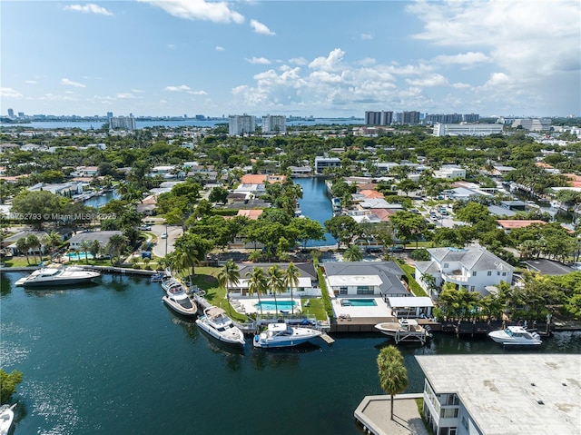 drone / aerial view featuring a water view and a city view