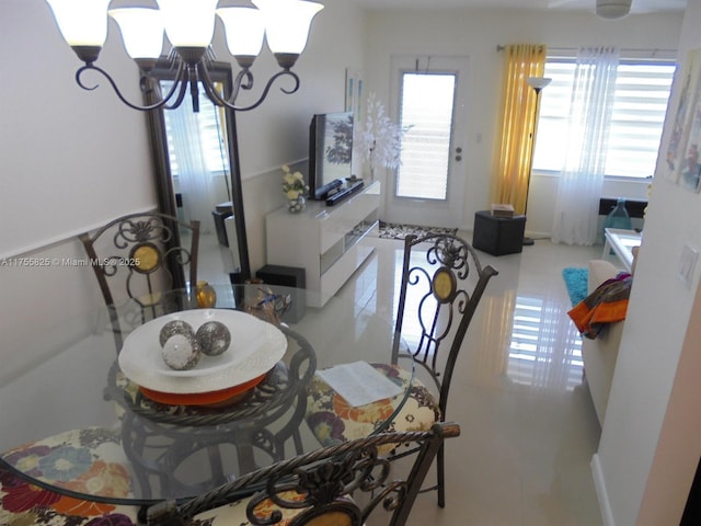 dining space featuring an inviting chandelier