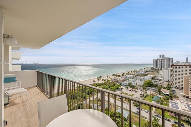 balcony with a view of city and a water view