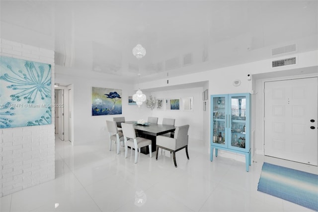 dining room featuring visible vents and light tile patterned floors