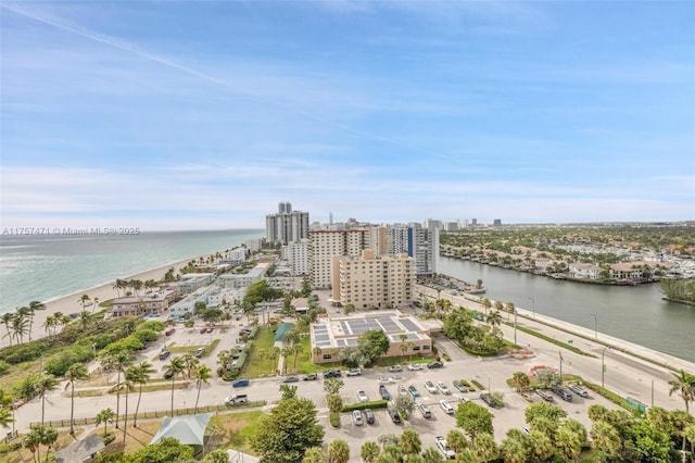 drone / aerial view featuring a water view and a view of city