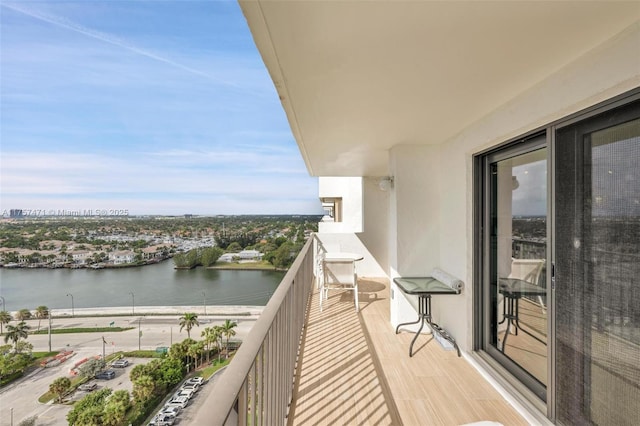 balcony featuring a water view