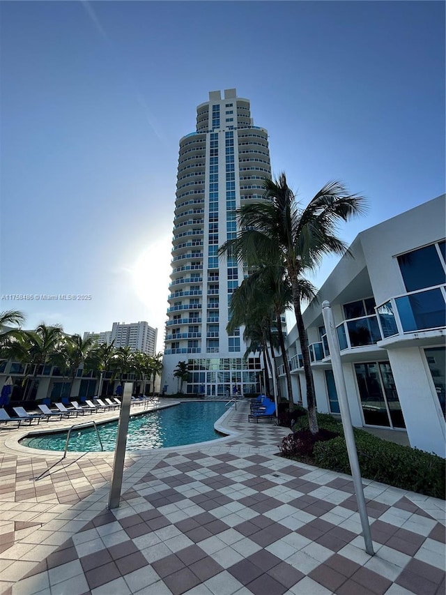 community pool featuring a patio area