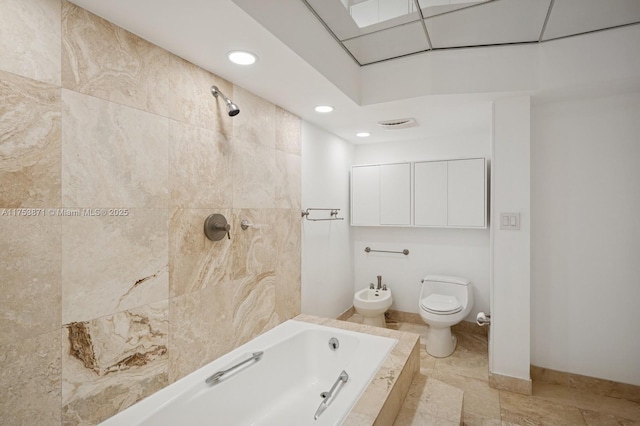 full bathroom featuring tiled bath, tiled shower, toilet, a bidet, and recessed lighting