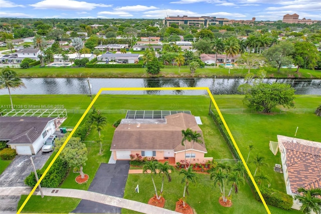 bird's eye view with a residential view and a water view