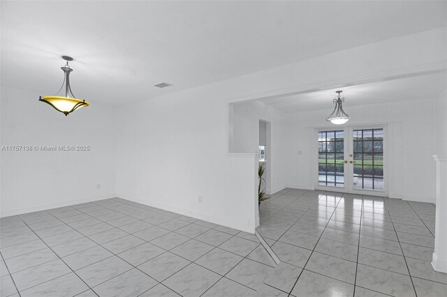 8790 SW 84th St, Miami, FL 33173 - spare room featuring light tile patterned flooring, visible vents, baseboards, and french doors
