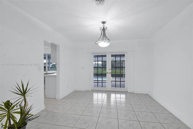 8790 SW 84th St, Miami, FL 33173 - empty room featuring a healthy amount of sunlight, baseboards, visible vents, and french doors