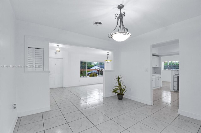8790 SW 84th St, Miami, FL 33173 - spare room with visible vents, plenty of natural light, baseboards, and light tile patterned floors