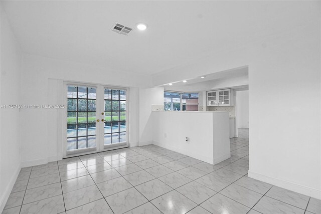 8790 SW 84th St, Miami, FL 33173 - unfurnished room with light tile patterned floors, baseboards, visible vents, and french doors
