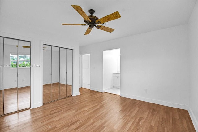 8790 SW 84th St, Miami, FL 33173 - unfurnished bedroom with baseboards, light wood-style floors, and multiple closets