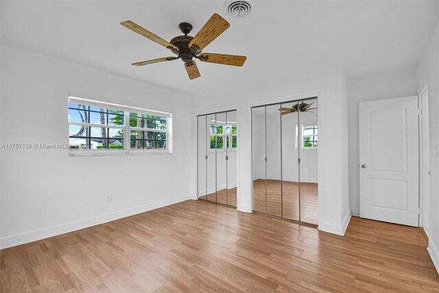 8790 SW 84th St, Miami, FL 33173 - unfurnished bedroom featuring a ceiling fan, baseboards, light wood-style floors, visible vents, and multiple closets