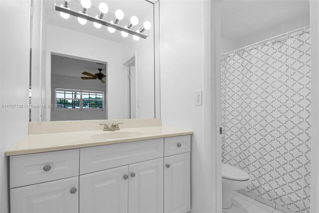 8790 SW 84th St, Miami, FL 33173 - bathroom featuring toilet, a shower with shower curtain, vanity, a ceiling fan, and tile patterned floors