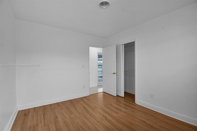 8790 SW 84th St, Miami, FL 33173 - unfurnished bedroom with light wood finished floors, baseboards, and visible vents