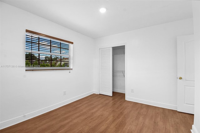 8790 SW 84th St, Miami, FL 33173 - unfurnished bedroom with a closet, baseboards, and wood finished floors
