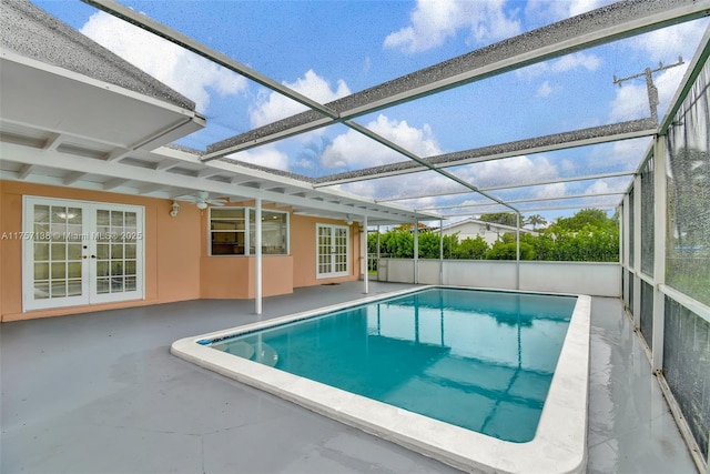 8790 SW 84th St, Miami, FL 33173 - view of swimming pool featuring glass enclosure, a ceiling fan, a patio, and french doors