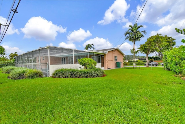 8790 SW 84th St, Miami, FL 33173 - rear view of house with glass enclosure, a lawn, and fence