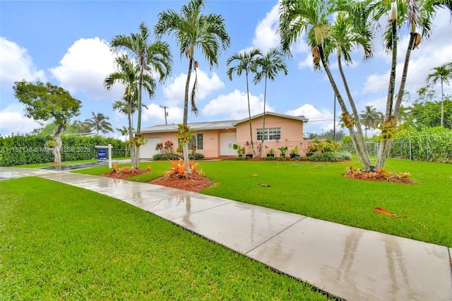 8790 SW 84th St, Miami, FL 33173 - ranch-style home featuring a garage, fence, a front lawn, and stucco siding