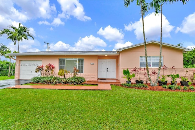 8790 SW 84th St, Miami, FL 33173 - ranch-style house featuring a front yard, an attached garage, and stucco siding