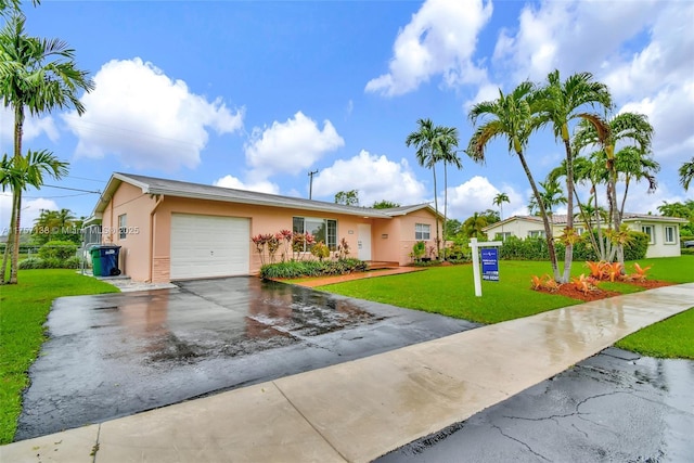 8790 SW 84th St, Miami, FL 33173 - ranch-style house featuring a garage, a front yard, concrete driveway, and stucco siding