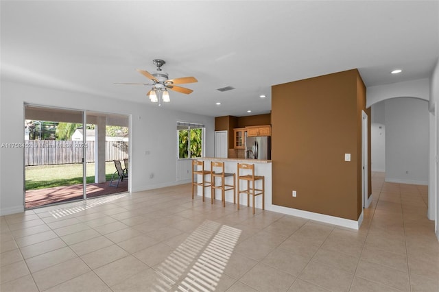 living room with light tile patterned flooring, recessed lighting, and visible vents