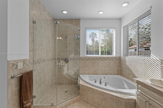 full bath with a bath, recessed lighting, a stall shower, and vanity