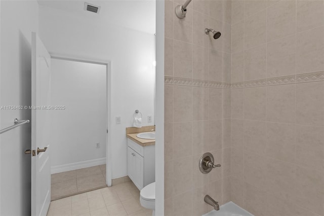 full bathroom featuring vanity, visible vents, shower / bathing tub combination, tile patterned floors, and toilet