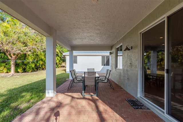 view of patio featuring outdoor dining space