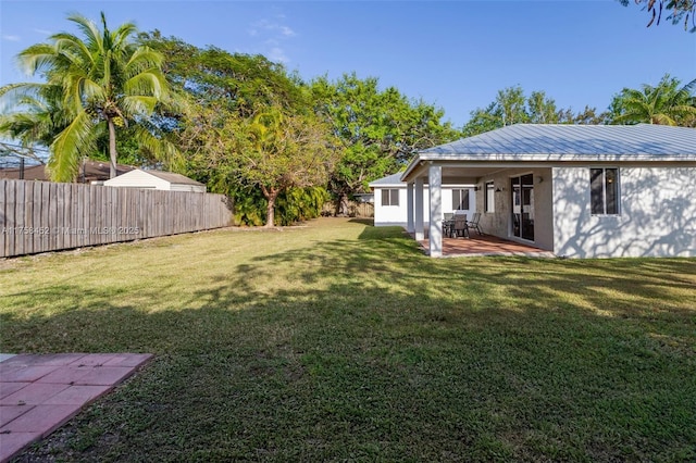 view of yard featuring a patio area and a fenced backyard