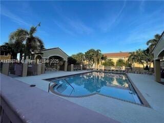 community pool featuring a patio area