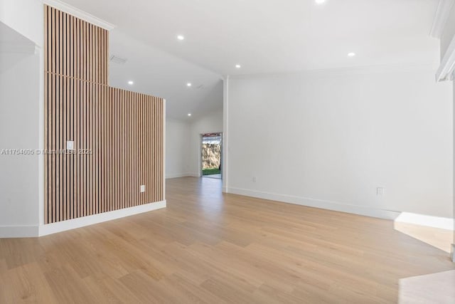 unfurnished room with light wood-type flooring, recessed lighting, baseboards, and lofted ceiling